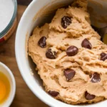 Bowl-of-creamy cottage cheese cookie dough, with chocolate chips.