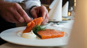 An elegant platter of smoked-salmon served with lemon slices, capers, dill.