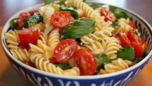 Freshly prepared pasta house salad with vibrant vegetables and signature dressing.